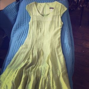 Ephemeral dress with pleats and tiered hem.